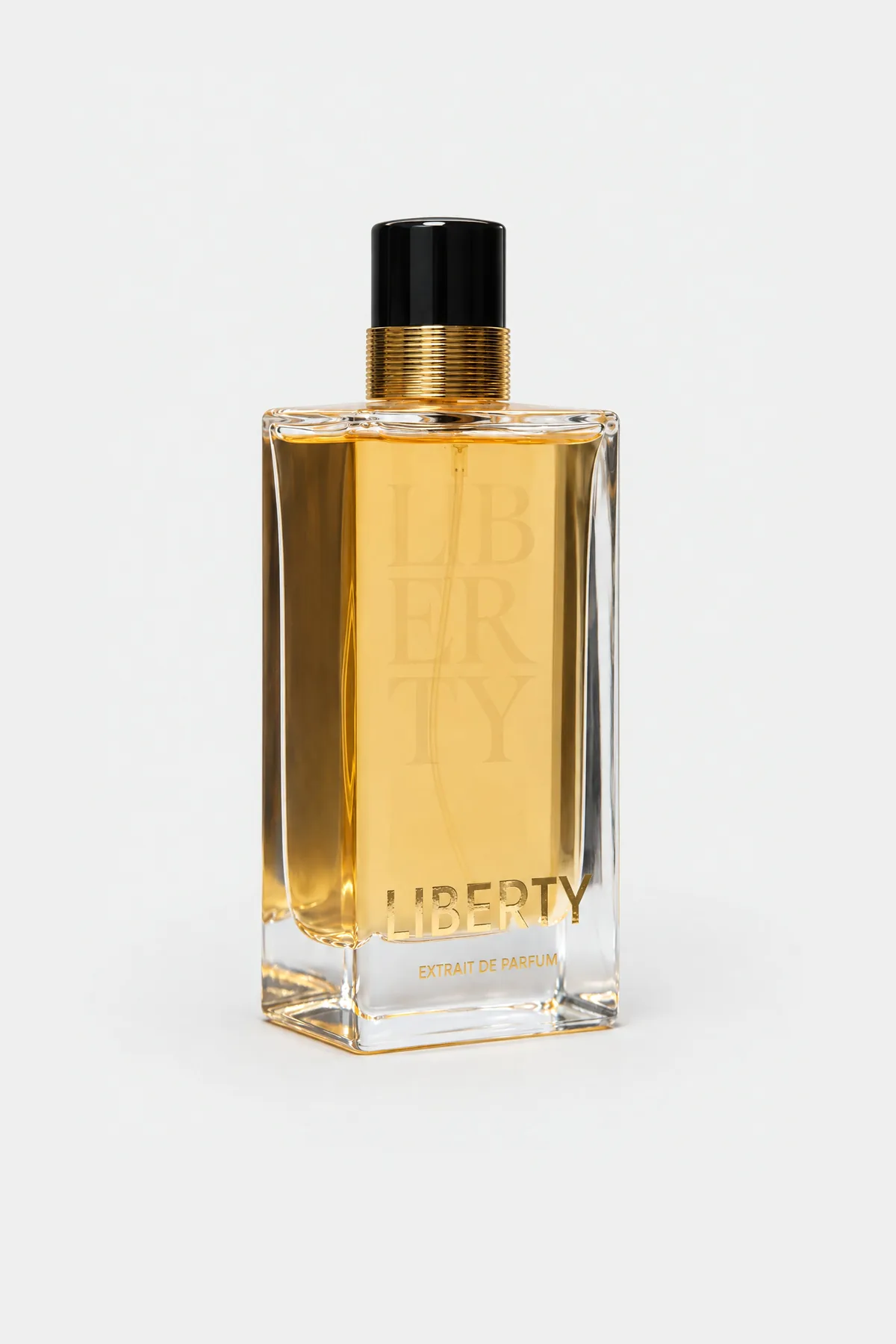 Fragrance World Liberty Extrait de Parfum 100 ml, tall clear bottle with pale gold liquid, three-quarter view